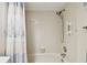 Bathroom featuring white tiled shower and blue patterned shower curtain at 2868 Denmarsh Ct, Palm Harbor, FL 34684