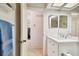 Bathroom featuring white vanity with marble countertop at 2868 Denmarsh Ct, Palm Harbor, FL 34684