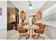 Bright kitchen with stainless steel appliances, wooden cabinetry, and a breakfast nook for everyday meals at 2868 Denmarsh Ct, Palm Harbor, FL 34684