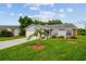 Charming single-story home featuring a well-maintained lawn and lovely landscaping at 2868 Denmarsh Ct, Palm Harbor, FL 34684