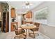 Bright kitchen with stainless steel appliances, wooden cabinetry, and a breakfast nook for everyday meals at 2868 Denmarsh Ct, Palm Harbor, FL 34684