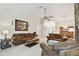 Bright living room with comfortable seating arrangements, perfect for entertaining guests and Gathering at 2868 Denmarsh Ct, Palm Harbor, FL 34684