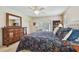 Spacious main bedroom featuring a walk out to a patio, carpet floors and fan at 2868 Denmarsh Ct, Palm Harbor, FL 34684