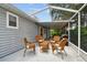 Relaxing screened patio has comfortable seating, offers a great view, and connects to the home at 2868 Denmarsh Ct, Palm Harbor, FL 34684