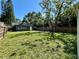 An exterior shot showing the backyard, back of house, a patio and a privacy fence at 3018 11Th N Ave, St Petersburg, FL 33713