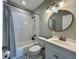A stylish bathroom with a white tiled shower and decorative tiled floor at 3018 11Th N Ave, St Petersburg, FL 33713