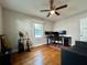 Comfortable bedroom with a ceiling fan, wood floors and sitting area at 3018 11Th N Ave, St Petersburg, FL 33713