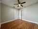 A basic bedroom featuring a ceiling fan and wood floors with closet and door access at 3018 11Th N Ave, St Petersburg, FL 33713