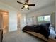 A comfortable bedroom featuring a ceiling fan, neutral carpet and access to a bathroom at 3018 11Th N Ave, St Petersburg, FL 33713