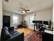 Comfortable bedroom with a ceiling fan, wood floors and sitting area at 3018 11Th N Ave, St Petersburg, FL 33713