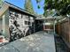 An exterior side view showing the carport, patio and privacy fence at 3018 11Th N Ave, St Petersburg, FL 33713
