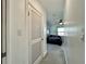 Hallway leading to bedroom with ceiling fan, neutral carpet, and a window at 3018 11Th N Ave, St Petersburg, FL 33713