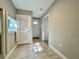 Hallway with tile flooring, window with natural light, and closet at 3018 11Th N Ave, St Petersburg, FL 33713