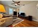Cozy living room features hardwood floors, ceiling fan, and large windows at 3018 11Th N Ave, St Petersburg, FL 33713