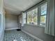 Sun room featuring patterned tile, neutral walls, and lots of natural light at 3018 11Th N Ave, St Petersburg, FL 33713