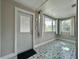 Bright sun room with decorative tile and large windows for natural light at 3018 11Th N Ave, St Petersburg, FL 33713