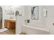 Bathroom featuring a soaking tub, separate vanity area, and modern fixtures at 30260 Birdhouse Dr, Wesley Chapel, FL 33545