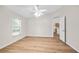 Bedroom featuring wood-look flooring and a ceiling fan at 30260 Birdhouse Dr, Wesley Chapel, FL 33545