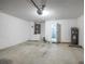 Spacious two-car garage with ample room for parking, storage, and a new water heater at 30260 Birdhouse Dr, Wesley Chapel, FL 33545