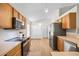 Functional kitchen with ample cabinet space, modern appliances, and an open layout at 30260 Birdhouse Dr, Wesley Chapel, FL 33545