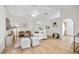 Bright living room with neutral tones, stylish furniture, wood-look flooring and an elegant area rug at 30260 Birdhouse Dr, Wesley Chapel, FL 33545