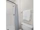 Shower/tub combo and white tile at 30260 Birdhouse Dr, Wesley Chapel, FL 33545