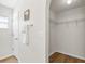 Walk-in closet with wood-look flooring and wire shelving at 30260 Birdhouse Dr, Wesley Chapel, FL 33545