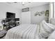 Functional bedroom featuring a desk, closet, and a decorative bed with stylish linens at 3226 Coventry N, Safety Harbor, FL 34695