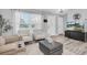 Cozy living room with neutral tones, plush seating, and a large window for natural light at 3226 Coventry N, Safety Harbor, FL 34695