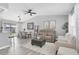 Open-concept living room featuring stylish decor, a dining area, and hardwood flooring at 3226 Coventry N, Safety Harbor, FL 34695
