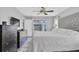 Well-lit main bedroom with a large bed, backyard access, and plenty of closet space at 3226 Coventry N, Safety Harbor, FL 34695