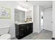 This bathroom features a granite vanity with a dark cabinet, along with neutral tiled floors at 345 Bayshore Blvd # 1510, Tampa, FL 33606