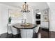 Cozy dining area featuring modern chandelier and round wood table at 345 Bayshore Blvd # 1510, Tampa, FL 33606