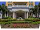 Grand entrance with columns, manicured greenery, and colorful flowers for a welcoming appeal at 345 Bayshore Blvd # 1510, Tampa, FL 33606