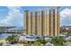 Condominium building with balconies overlooking waterfront, covered parking and gorgeous yellow facade, blending comfort and urban elegance at 345 Bayshore Blvd # 1510, Tampa, FL 33606