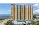 Luxury condominium with balconies and covered parking showcases vibrant yellow facade near waterfront, epitomizing upscale urban living at 345 Bayshore Blvd # 1510, Tampa, FL 33606