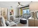 Living room with neutral decor, modern ceiling fan and a balcony overlooking the city skyline at 345 Bayshore Blvd # 1510, Tampa, FL 33606