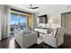 Bright living room with dark floors, comfy seating, and a scenic balcony view at 345 Bayshore Blvd # 1510, Tampa, FL 33606