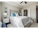 Main bedroom featuring a ceiling fan, walk-in closet, and a plush bed with blue accent pillows at 345 Bayshore Blvd # 1510, Tampa, FL 33606