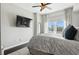 This modern main bedroom has hardwood floors, a ceiling fan, and a spectacular cityscape view at 345 Bayshore Blvd # 1510, Tampa, FL 33606