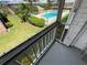 An aerial view from a balcony overlooking a pool, lush landscaping, and low-rise buildings at 3535 41St S Ter # 219, St Petersburg, FL 33701