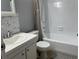 Bright bathroom with a white shower-tub combination and single sink vanity at 3535 41St S Ter # 219, St Petersburg, FL 33701