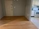 Dining room with hardwood floors and a view into the kitchen area with modern appliances at 3535 41St S Ter # 219, St Petersburg, FL 33701