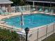 Community pool with several lounge chairs and a blue swimming pool at 3535 41St S Ter # 219, St Petersburg, FL 33701