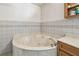 Bathroom features a corner soaking tub with tile surround and a built-in vanity at 3601 27Th S Ave, St Petersburg, FL 33711