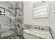 Updated bathroom with stylish tile work and modern fixtures at 3601 27Th S Ave, St Petersburg, FL 33711