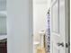 A half bathroom has pedestal sink, toilet and a shower curtain at 3601 27Th S Ave, St Petersburg, FL 33711