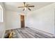 Bright bedroom features gray laminate flooring and a neutral color scheme at 3601 27Th S Ave, St Petersburg, FL 33711