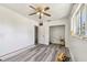 Bedroom featuring gray laminate flooring, natural light and a closet at 3601 27Th S Ave, St Petersburg, FL 33711