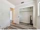 Bedroom closet features wood laminate floors, a small window, and storage at 3601 27Th S Ave, St Petersburg, FL 33711